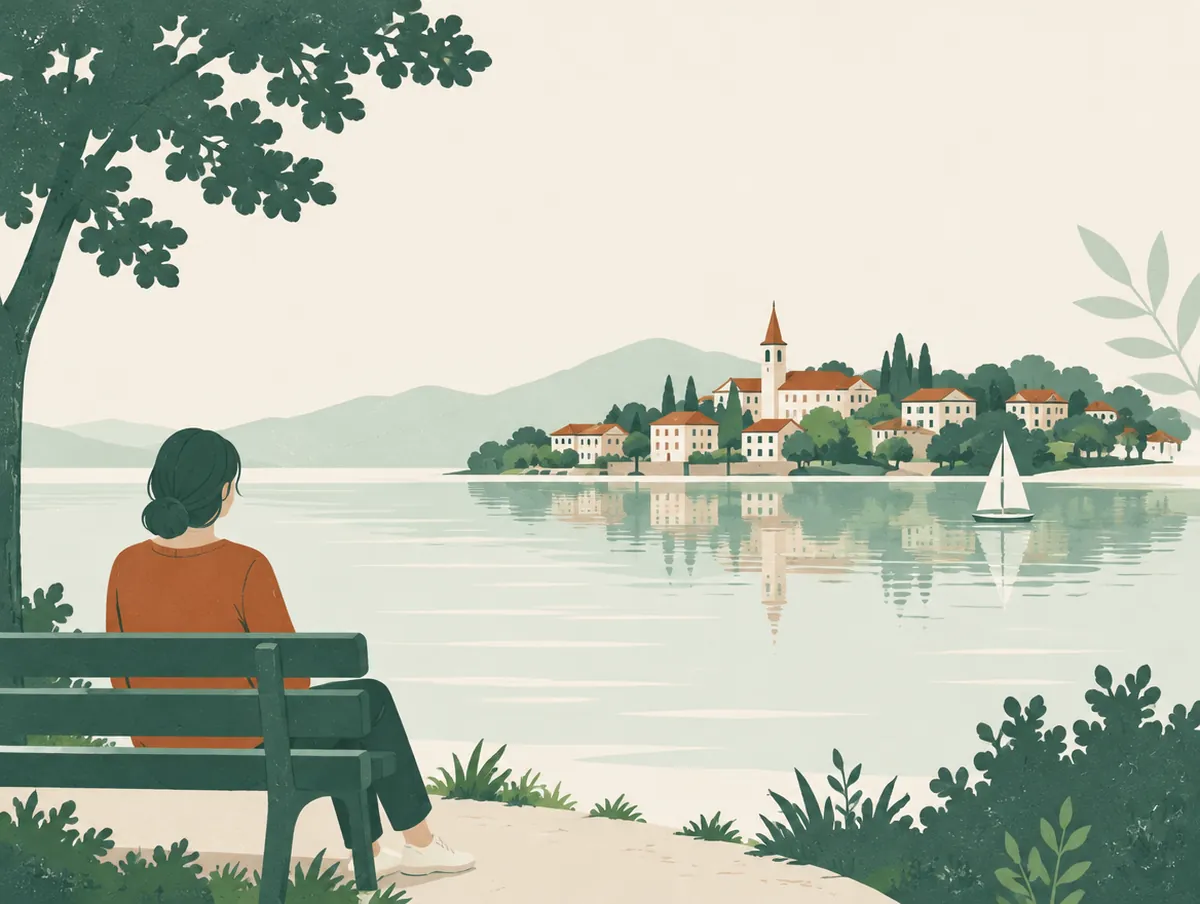 Illustration: A lakeside view of a small town with trees and calm water
