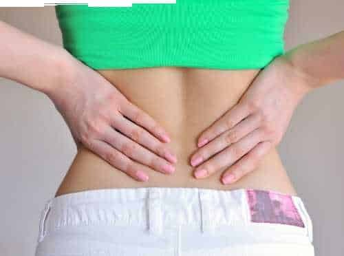 Hands resting on the lower back